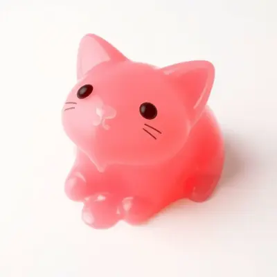 A cute and aesthetic jelly cat made of translucent pink gelatin, with glossy jelly drips
melting down its body, soft reflecti
