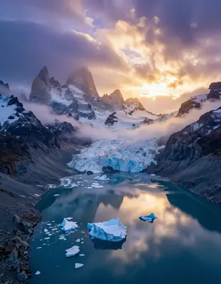 Patagonian glaciers sprawl across a surreal, alien landscape, illuminated by the warm, golden light of dawn, as turbulent sto