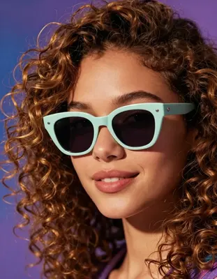A photorealistic close-up portrait of a young woman with warm golden brown skin and vibrant curly hair, set against a soft fo