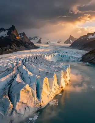 A sprawling aerial view of a surreal Patagonian glacier landscape at golden hour, with towering serpentine ice formations glo